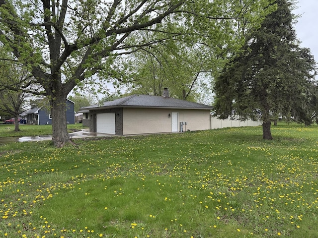 405 9th St, Mazon, IL 60444 - view of yard featuring an attached garage and an outbuilding
