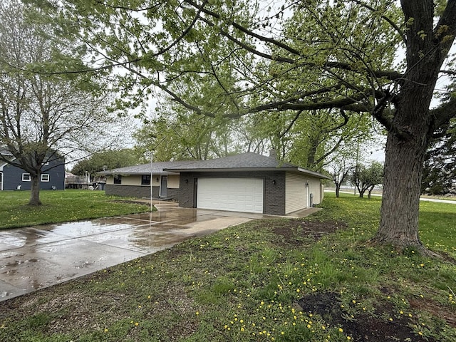 405 9th St, Mazon, IL 60444 - view of property exterior with a garage, concrete driveway, a yard, and brick siding