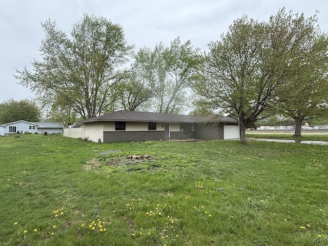 405 9th St, Mazon, IL 60444 - exterior space with an attached garage and a yard