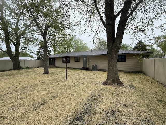 405 9th St, Mazon, IL 60444 - rear view of house with cooling unit and a fenced backyard
