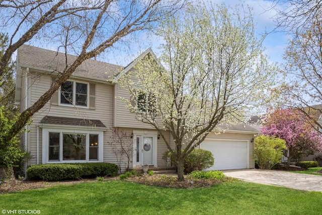 view of front facade with concrete driveway, roof with shingles, a front yard, and a garage