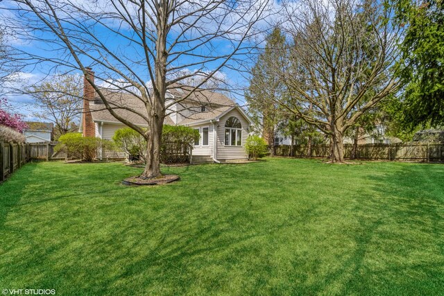 view of yard featuring a fenced backyard