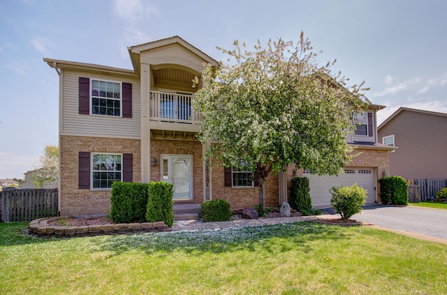 1120 Redwood Ln, Minooka, IL 60447 - view of front facade with brick siding, a garage, and fence