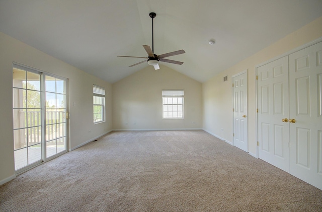 1120 Redwood Ln, Minooka, IL 60447 - empty room with light colored carpet, a ceiling fan, baseboards, and vaulted ceiling