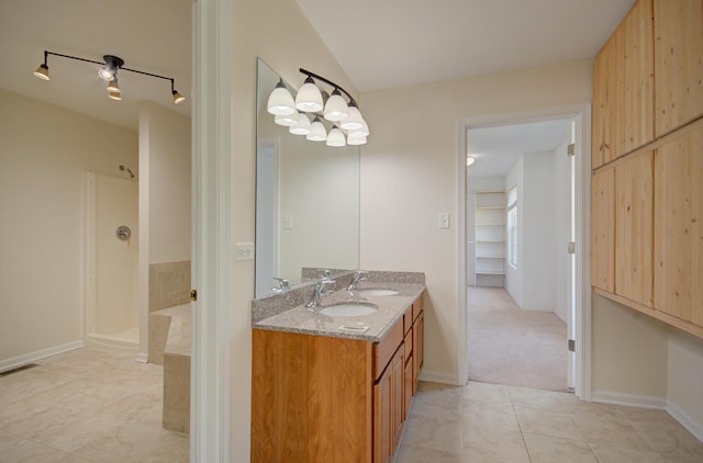 1120 Redwood Ln, Minooka, IL 60447 - full bath featuring double vanity, visible vents, tile patterned flooring, a sink, and lofted ceiling
