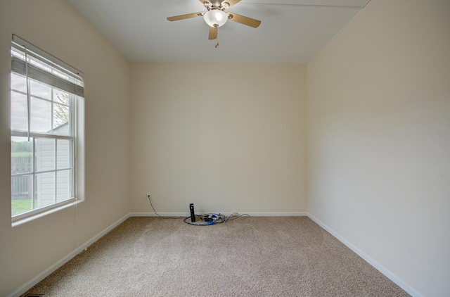 1120 Redwood Ln, Minooka, IL 60447 - carpeted spare room featuring a ceiling fan and baseboards