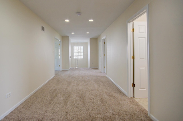 1120 Redwood Ln, Minooka, IL 60447 - hallway with recessed lighting, baseboards, and light colored carpet