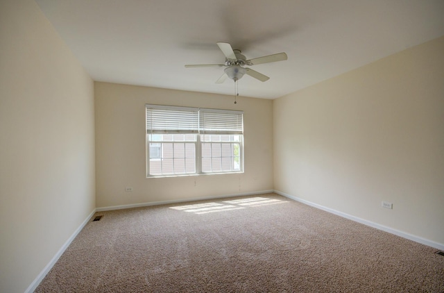1120 Redwood Ln, Minooka, IL 60447 - empty room with baseboards, carpet, ceiling fan, and visible vents