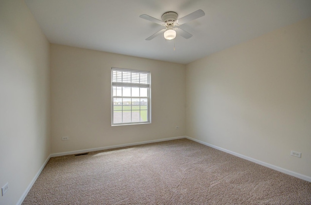 1120 Redwood Ln, Minooka, IL 60447 - spare room with carpet flooring, ceiling fan, visible vents, and baseboards