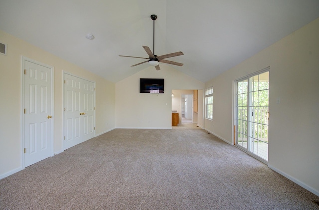 1120 Redwood Ln, Minooka, IL 60447 - unfurnished living room with baseboards, a ceiling fan, carpet, and lofted ceiling