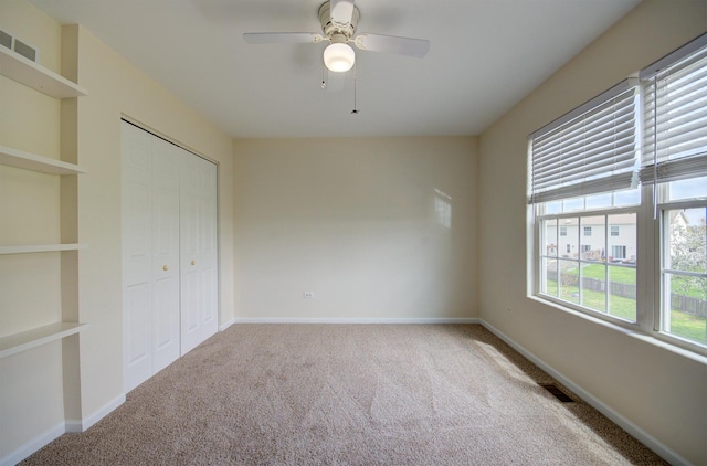1120 Redwood Ln, Minooka, IL 60447 - unfurnished bedroom featuring carpet flooring, baseboards, visible vents, and a closet