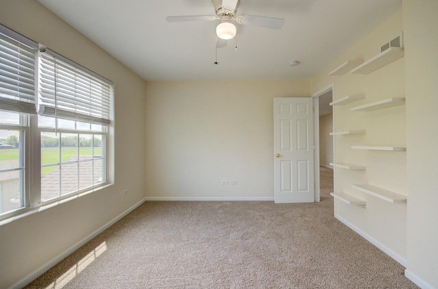 1120 Redwood Ln, Minooka, IL 60447 - carpeted spare room featuring baseboards, a ceiling fan, and visible vents