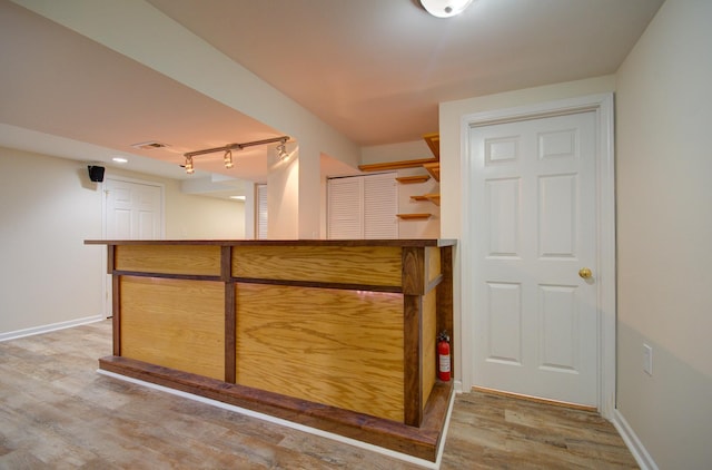 1120 Redwood Ln, Minooka, IL 60447 - bar featuring baseboards, wood finished floors, and visible vents