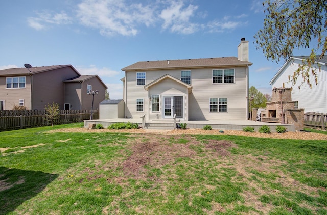 1120 Redwood Ln, Minooka, IL 60447 - back of property with an outdoor structure, fence, a chimney, and a shed