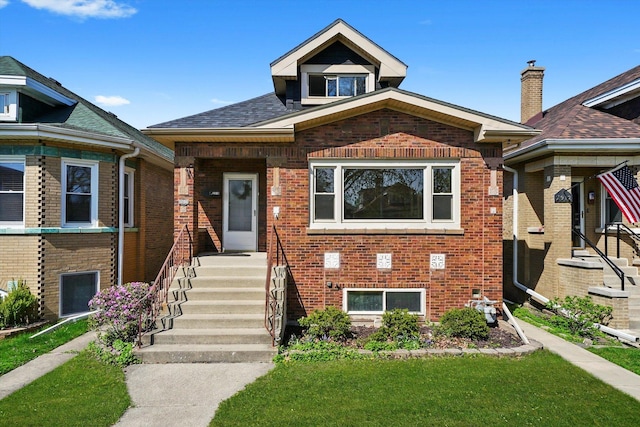2910 N 76th Ct, Elmwood Park, IL 60707 - bungalow-style home with brick siding and a front yard