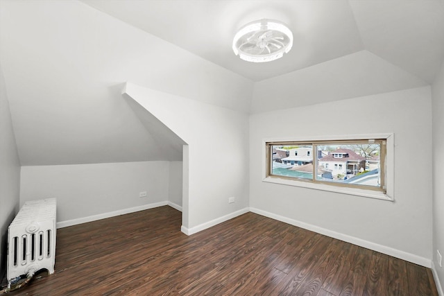 2910 N 76th Ct, Elmwood Park, IL 60707 - additional living space featuring lofted ceiling, wood finished floors, baseboards, and radiator heating unit