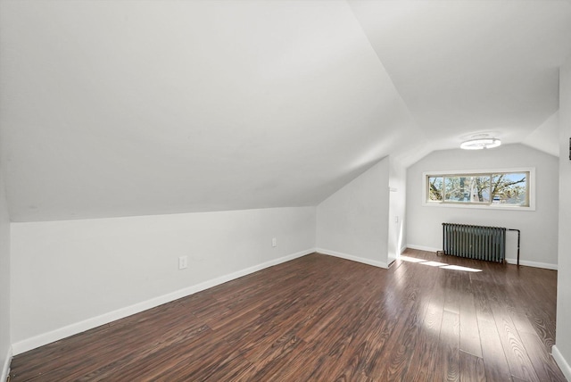 2910 N 76th Ct, Elmwood Park, IL 60707 - bonus room featuring radiator, lofted ceiling, dark wood-type flooring, and baseboards