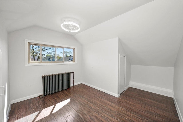 2910 N 76th Ct, Elmwood Park, IL 60707 - additional living space with radiator heating unit, lofted ceiling, wood finished floors, and baseboards