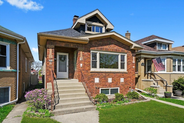 2910 N 76th Ct, Elmwood Park, IL 60707 - bungalow with a chimney, brick siding, a front yard, and a shingled roof