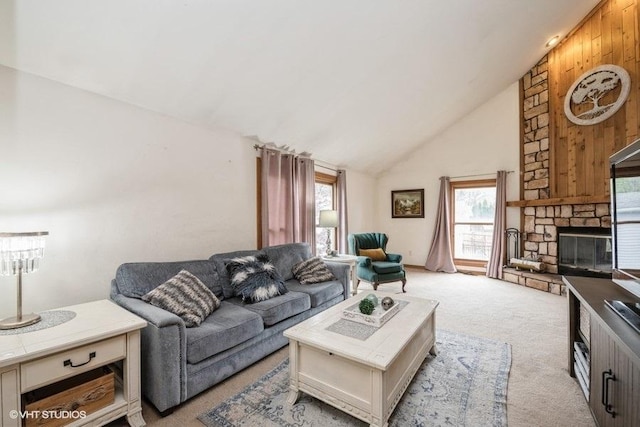 27833 W Bayview Dr, Ingleside, IL 60041 - living area with a stone fireplace, wooden walls, high vaulted ceiling, and light colored carpet