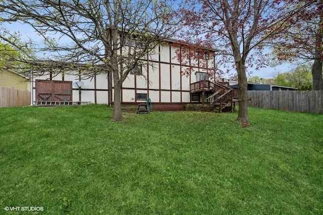 27833 W Bayview Dr, Ingleside, IL 60041 - view of yard featuring a deck, stairway, an outdoor structure, and a fenced backyard