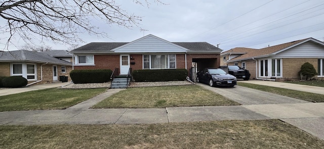 bungalow with concrete driveway, brick siding, an attached garage, and a front yard