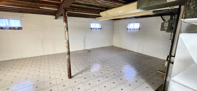 below grade area with tile patterned floors and a wealth of natural light