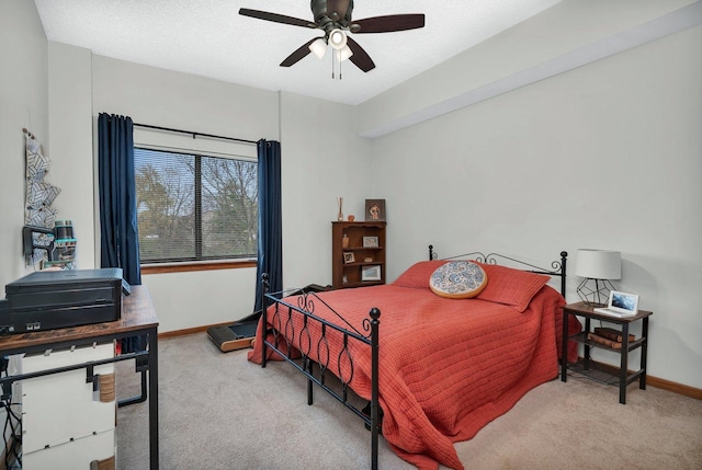 bedroom with carpet flooring, baseboards, and ceiling fan
