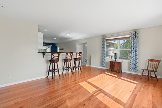 interior space featuring light wood-style floors, recessed lighting, and baseboards