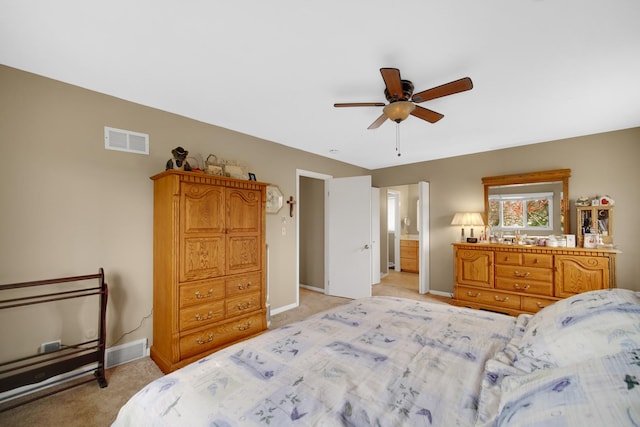 bedroom featuring visible vents, a ceiling fan, baseboards, and light carpet