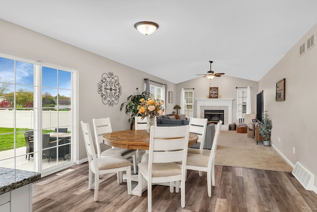 dining area featuring a ceiling fan, visible vents, and a wealth of natural light