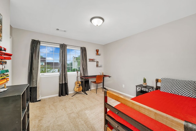 carpeted bedroom with baseboards and visible vents