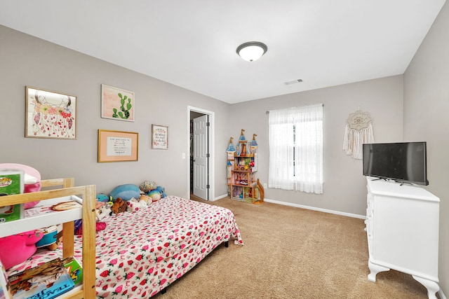 bedroom with baseboards, carpet flooring, and visible vents