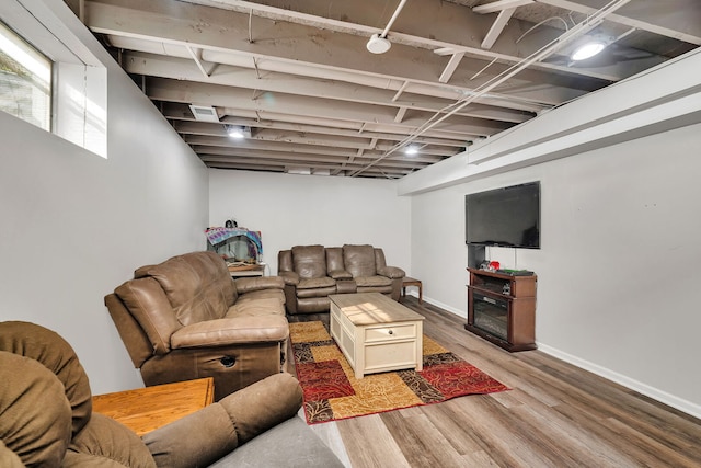 living room featuring baseboards and wood finished floors