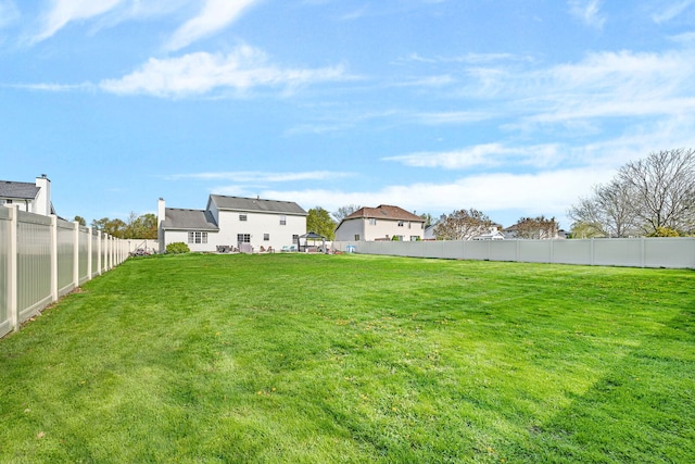 view of yard with a fenced backyard