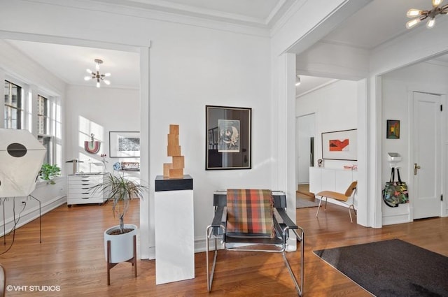 2311 N Commonwealth Ave Unit 3E, Chicago, IL 60614 - foyer entrance with crown molding, wood finished floors, and a notable chandelier