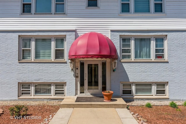 9459 Kelvin Ln Unit 2665, Schiller Park, IL 60176 - view of exterior entry featuring brick siding