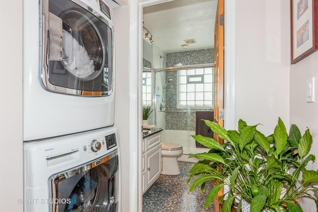 9459 Kelvin Ln Unit 2665, Schiller Park, IL 60176 - clothes washing area with stacked washer and clothes dryer and laundry area