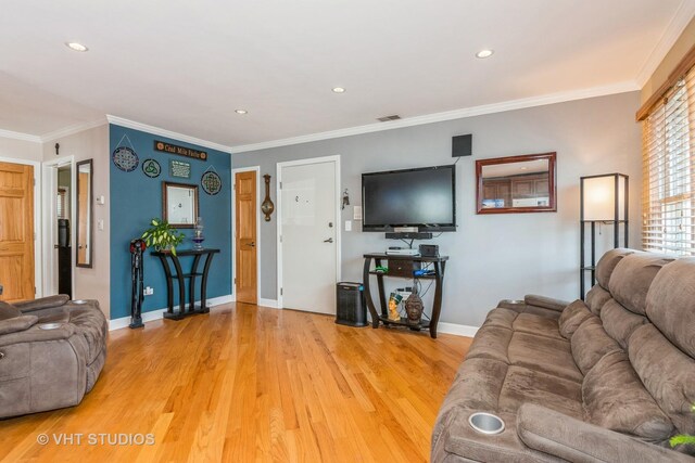 9459 Kelvin Ln Unit 2665, Schiller Park, IL 60176 - living room with light wood-style floors, baseboards, ornamental molding, and visible vents