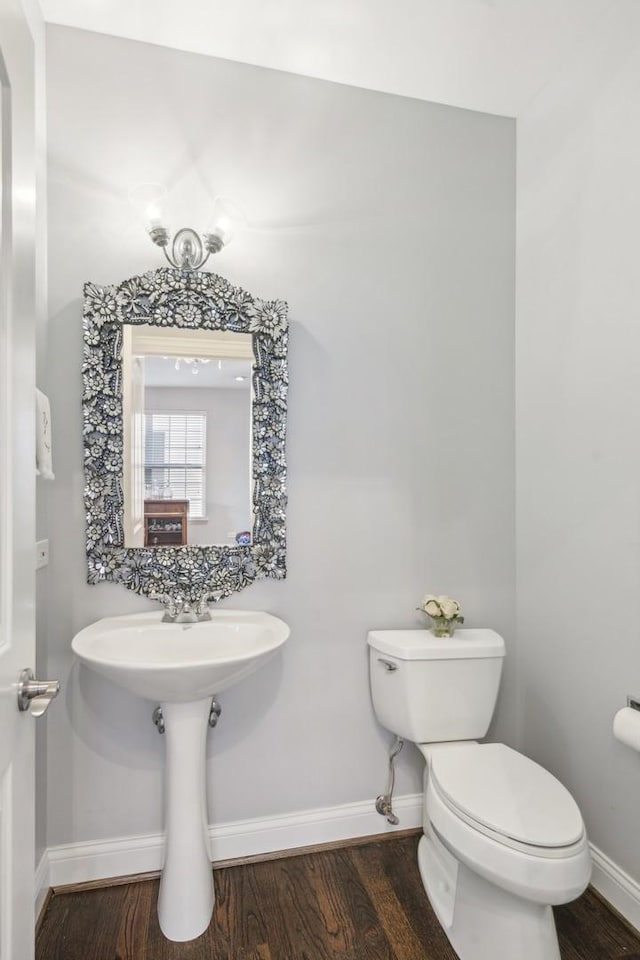168 Willow Blvd, Willow Springs, IL 60480 - half bath with baseboards, toilet, and wood finished floors