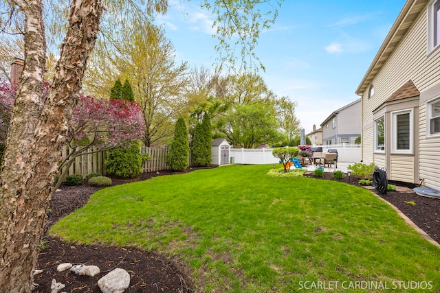 view of yard featuring a fenced backyard, an outdoor structure, a patio, and a storage shed