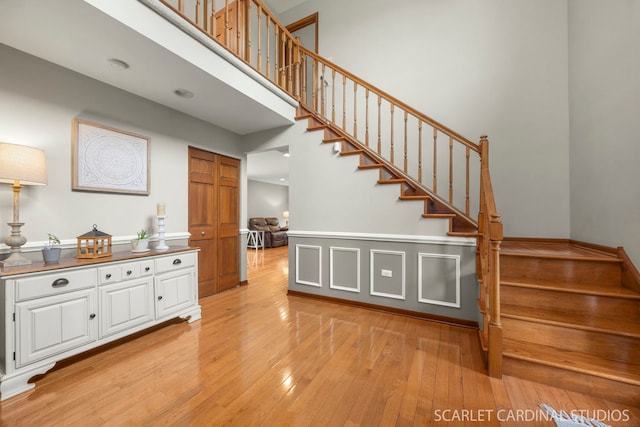 staircase with hardwood / wood-style floors