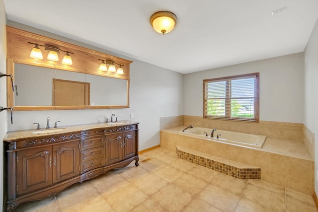 full bath featuring a sink, a garden tub, and double vanity