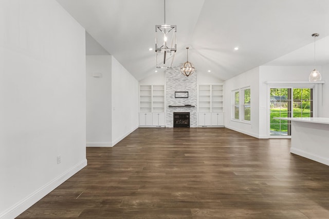 unfurnished living room featuring lofted ceiling, built in features, baseboards, dark wood finished floors, and a chandelier