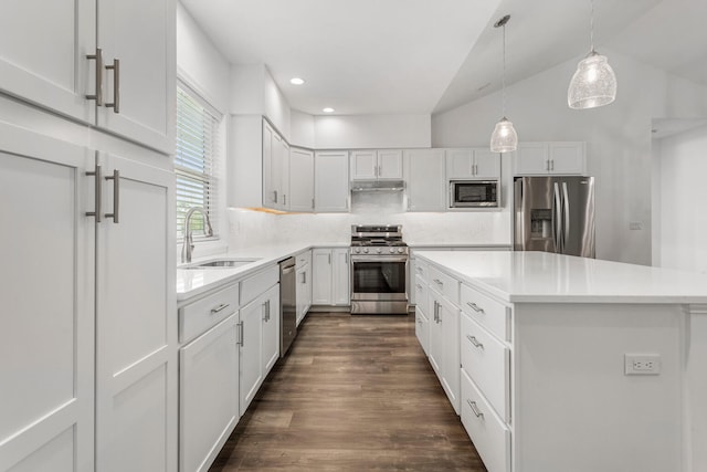 kitchen with appliances with stainless steel finishes, a sink, white cabinets, light countertops, and dark wood-style floors
