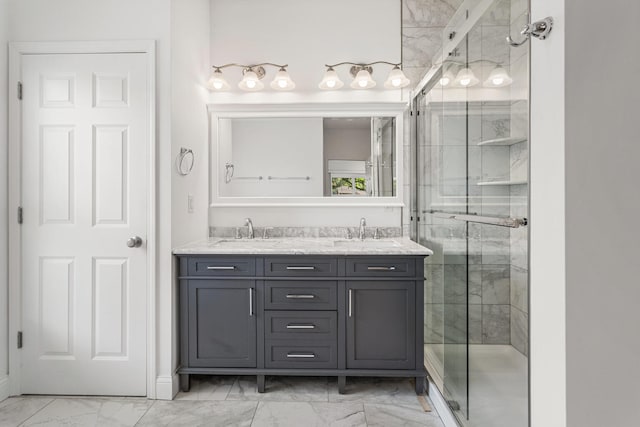 full bath with marble look tile flooring, a stall shower, and double vanity