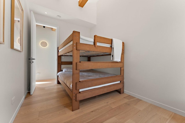 bedroom featuring light wood-style flooring and baseboards