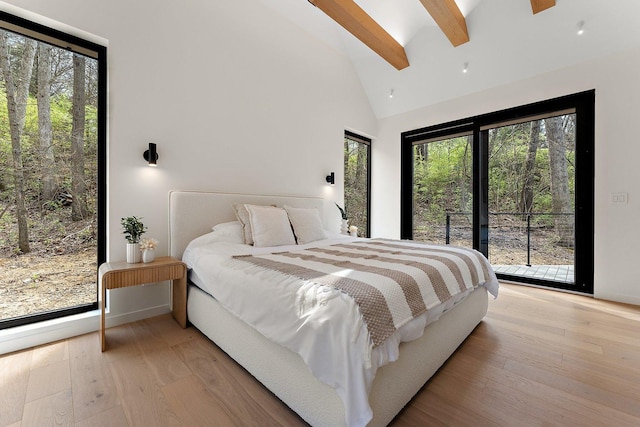 bedroom with access to exterior, light wood finished floors, multiple windows, beamed ceiling, and high vaulted ceiling