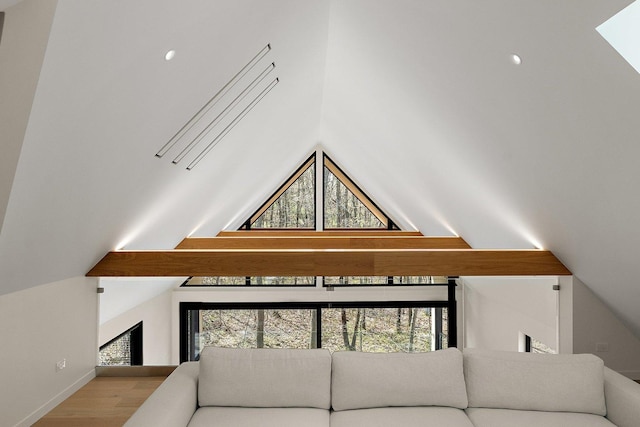 living area with vaulted ceiling, wood finished floors, and recessed lighting
