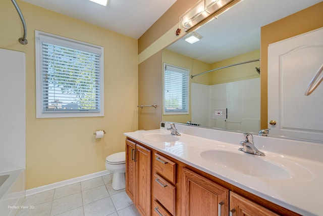 573 W Babcock Ave, Elmhurst, IL 60126 - bathroom with toilet, tile patterned flooring, baseboards, a shower, and double vanity